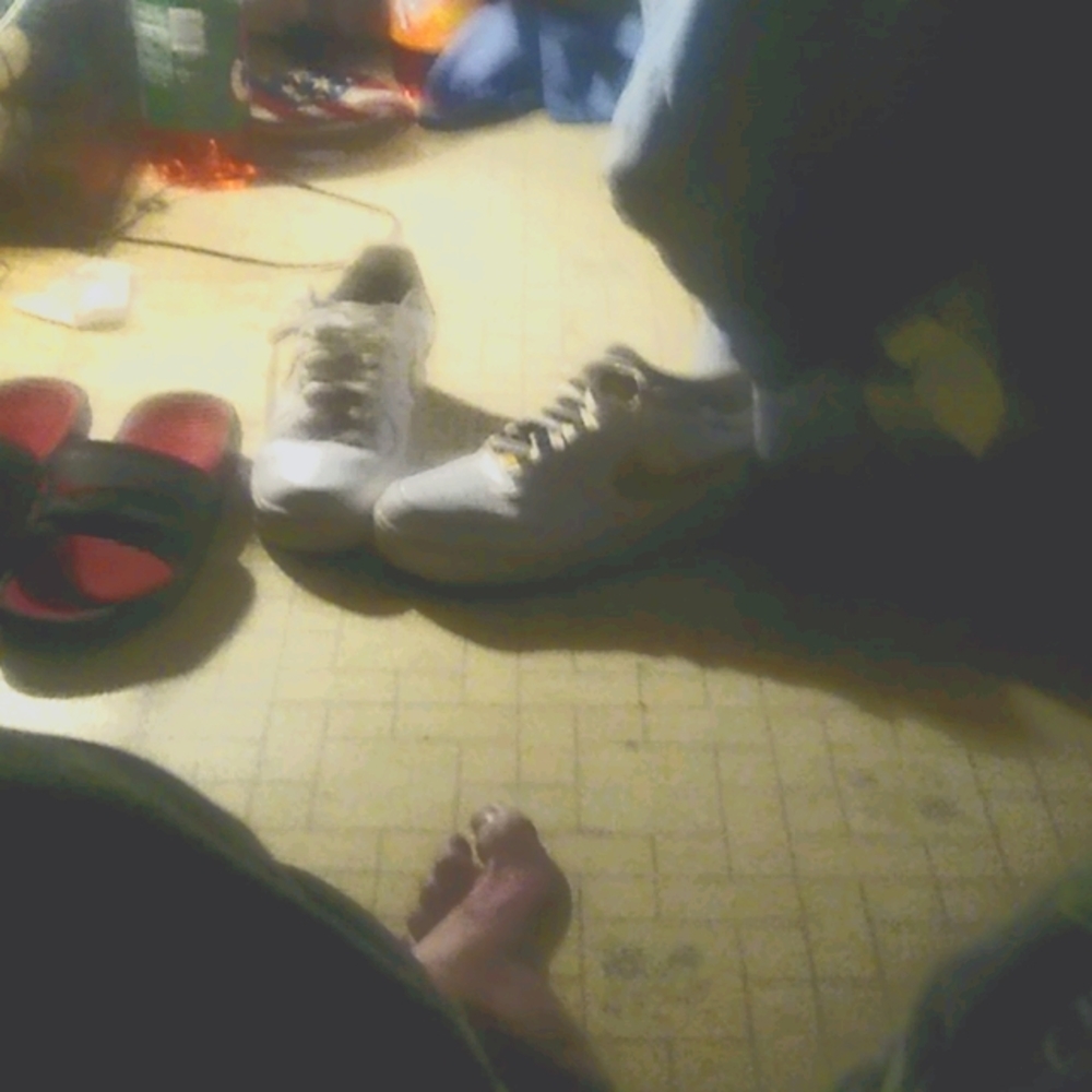 A pair of Nike air force ones and nike sandals